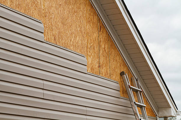 Professional Siding Contractor technician working in Riverside, MD